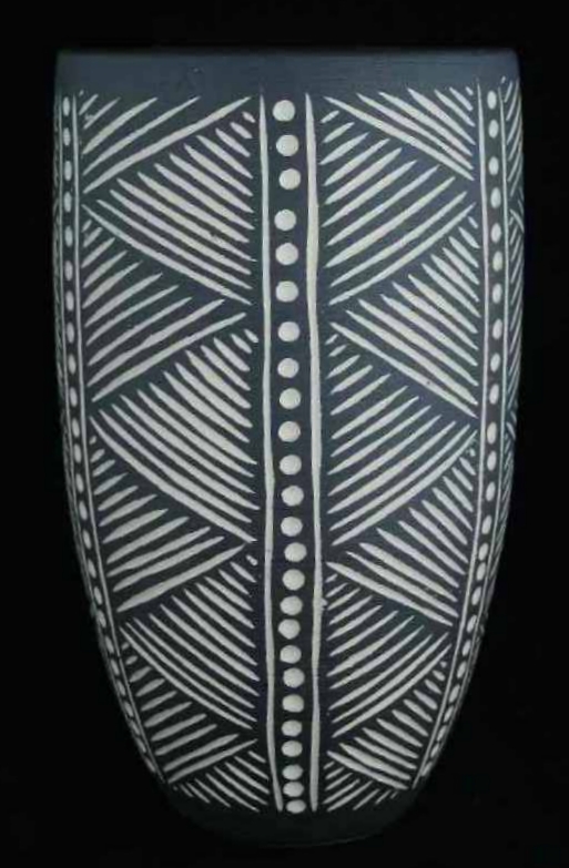 White stoneware vase with incised black slip African style pattern